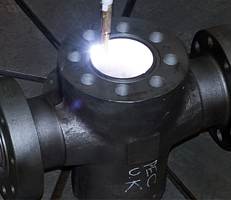 Small bore weld claddin torch in operation